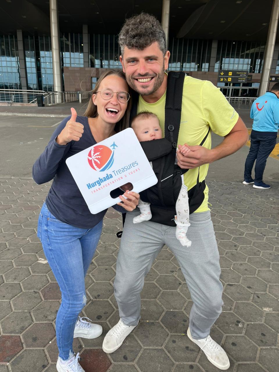 Family with baby greeted by Hurghada Treasures at the airport